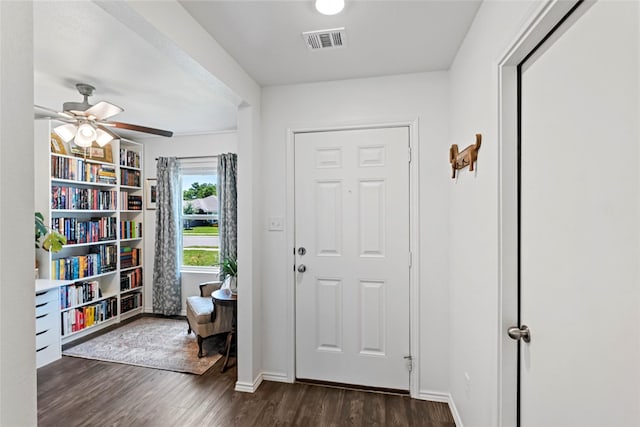 2117 Heritage Meadow Ln, Bryan, TX 77803 - entryway featuring dark wood-style floors, a ceiling fan, and baseboards