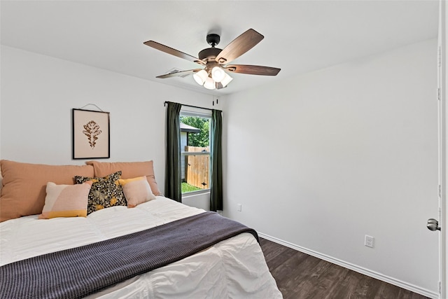 2117 Heritage Meadow Ln, Bryan, TX 77803 - bedroom with dark wood-type flooring, baseboards, and ceiling fan