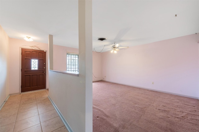 6046 Harbrook Dr, Houston, TX 77087 - entryway with baseboards, ceiling fan, light tile patterned floors, and light carpet