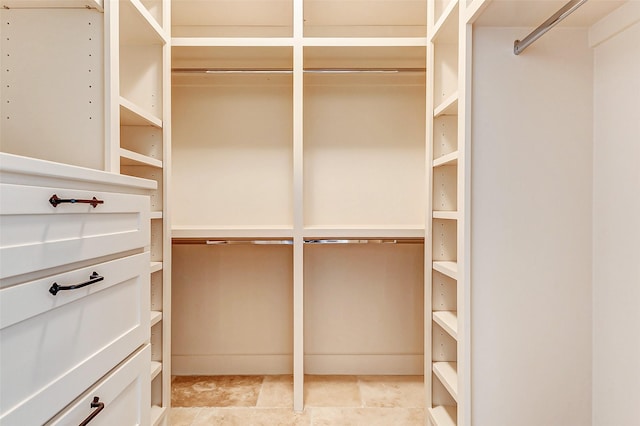 2714 W Trail Ct, Richmond, TX 77406 - spacious closet featuring light stone finish flooring