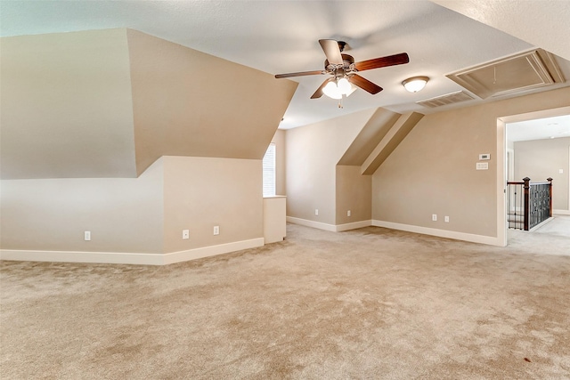 2714 W Trail Ct, Richmond, TX 77406 - additional living space featuring attic access, a ceiling fan, carpet, baseboards, and vaulted ceiling