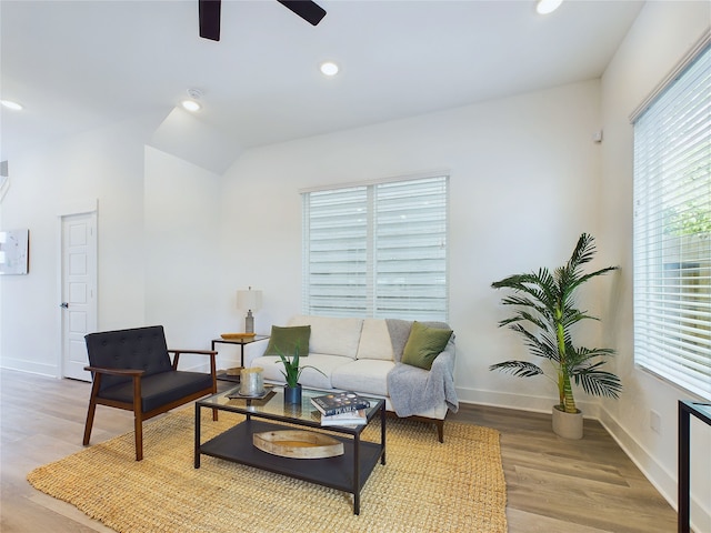 5808 Highland Sky Ln, Houston, TX 77091 - living room with light wood-type flooring, a ceiling fan, baseboards, and recessed lighting
