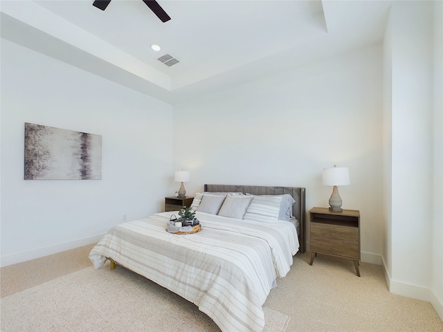 5808 Highland Sky Ln, Houston, TX 77091 - bedroom featuring light carpet, baseboards, a tray ceiling, and ceiling fan