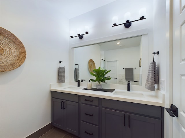 5808 Highland Sky Ln, Houston, TX 77091 - bathroom with double vanity and baseboards