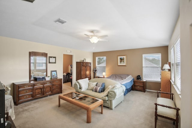 723 Slate Valley Ln, Spring, TX 77373 - bedroom featuring light carpet, a walk in closet, ceiling fan, and baseboards