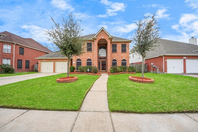 14731 Ravenscroft Way, Houston, TX 77083 - colonial inspired home with a garage, brick siding, and concrete driveway