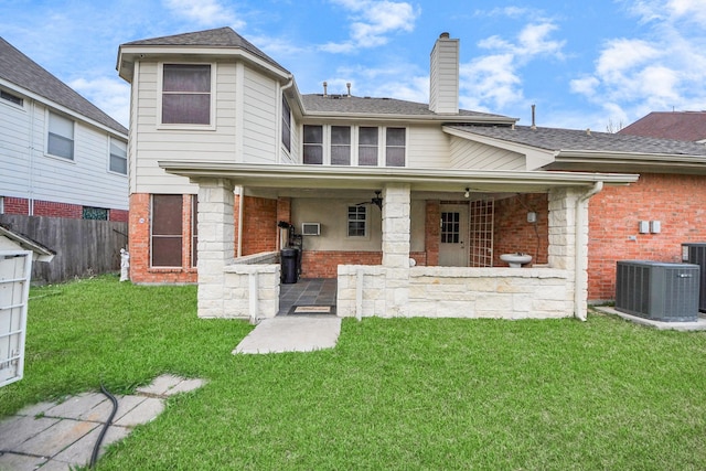 14731 Ravenscroft Way, Houston, TX 77083 - rear view of property with brick siding, central AC, a chimney, and roof with shingles