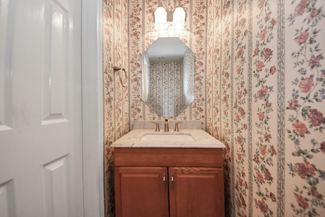 14731 Ravenscroft Way, Houston, TX 77083 - bathroom featuring wallpapered walls and vanity