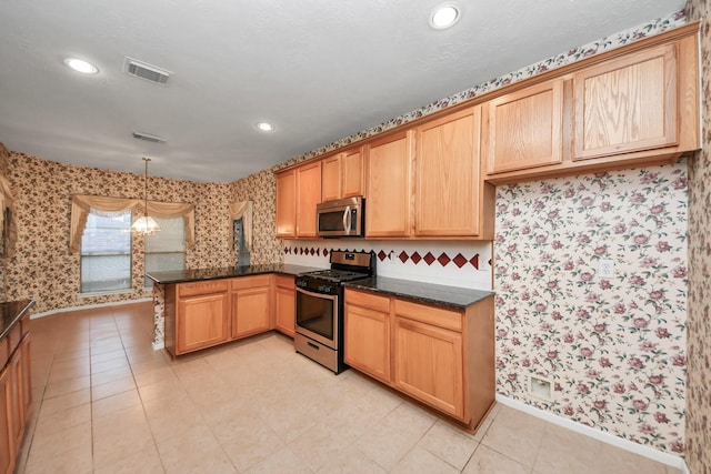 14731 Ravenscroft Way, Houston, TX 77083 - kitchen featuring appliances with stainless steel finishes, a peninsula, wallpapered walls, baseboards, and recessed lighting