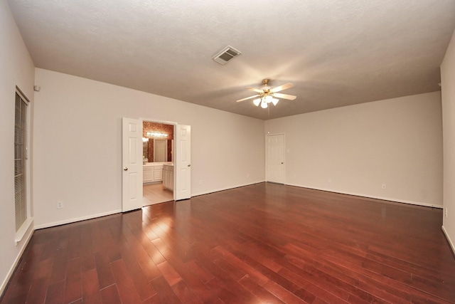 14731 Ravenscroft Way, Houston, TX 77083 - empty room with wood finished floors, a ceiling fan, and baseboards