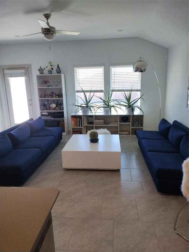 19027 Drayton Village Trce, Richmond, TX 77407 - living area featuring ceiling fan, light tile patterned floors, and vaulted ceiling
