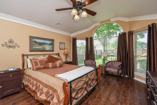 bedroom featuring dark wood finished floors, lofted ceiling, crown molding, a ceiling fan, and baseboards
