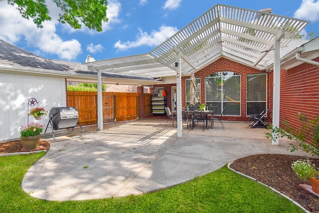 view of patio featuring a pergola, fence, and area for grilling