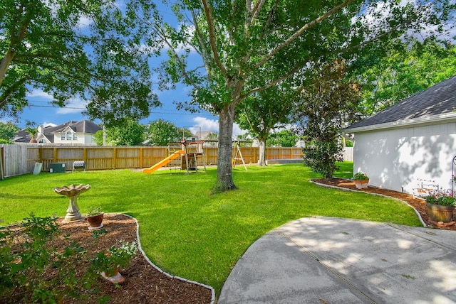 view of yard with a playground and a patio area