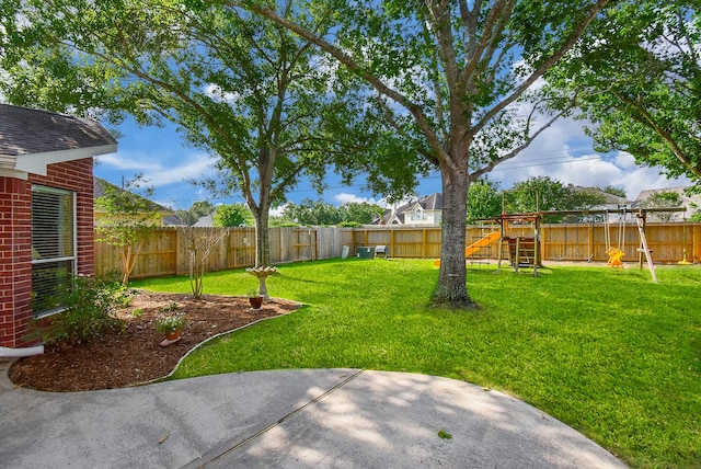 view of yard featuring a playground and a patio area