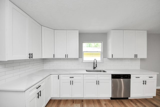 1914 Round Wind Trl, Crosby, TX 77532 - kitchen with dishwasher, a sink, light countertops, and wood finished floors