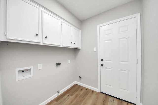 1914 Round Wind Trl, Crosby, TX 77532 - laundry room with hookup for a washing machine, cabinet space, light wood-style flooring, electric dryer hookup, and baseboards