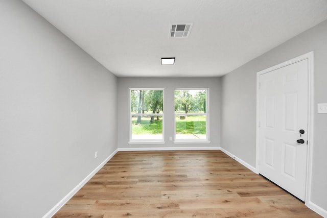 1914 Round Wind Trl, Crosby, TX 77532 - empty room with light wood finished floors and baseboards