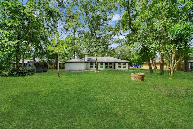 1914 Round Wind Trl, Crosby, TX 77532 - view of green lawn featuring a storage shed and an outdoor structure