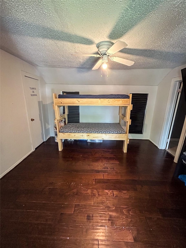 275 Georgia St, Houston, TX 77029 - bedroom featuring hardwood / wood-style floors, a textured ceiling, ceiling fan, and baseboards