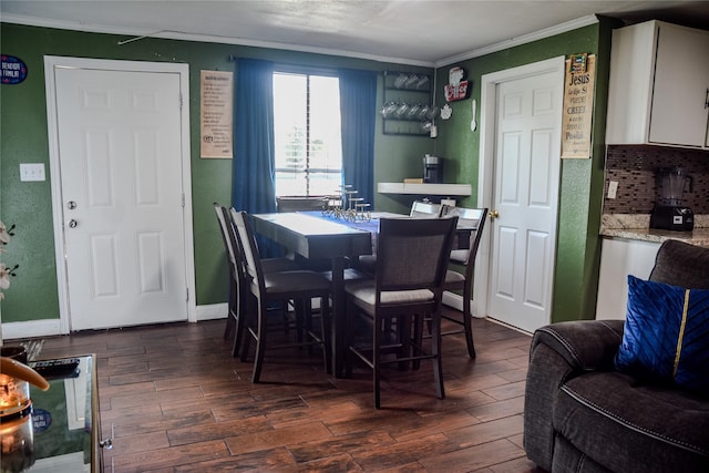 275 Georgia St, Houston, TX 77029 - dining area featuring dark wood-type flooring, crown molding, and baseboards