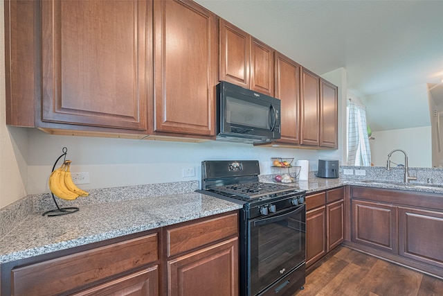 14502 Myrtle Hill Dr, Houston, TX 77069 - kitchen with black appliances, a sink, dark wood-style flooring, and light stone countertops