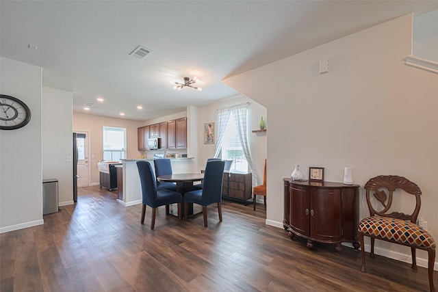 14502 Myrtle Hill Dr, Houston, TX 77069 - dining area with dark wood finished floors, baseboards, and recessed lighting