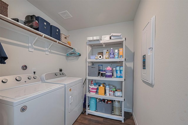 14502 Myrtle Hill Dr, Houston, TX 77069 - laundry room with washing machine and clothes dryer and dark wood finished floors