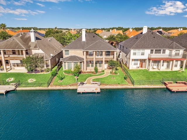 aerial perspective of suburban area with a large body of water
