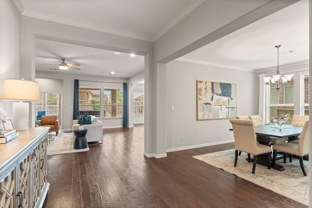 1830 Britton Key Ln, Spring, TX 77386 - dining space with dark wood-style flooring, a chandelier, baseboards, ornamental molding, and ceiling fan