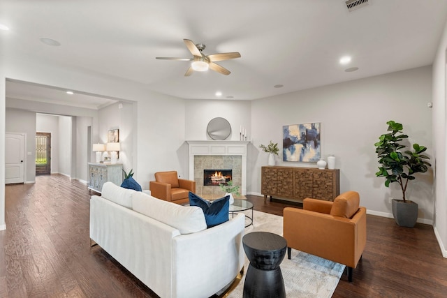 1830 Britton Key Ln, Spring, TX 77386 - living room with a ceiling fan, a tiled fireplace, baseboards, dark wood finished floors, and recessed lighting