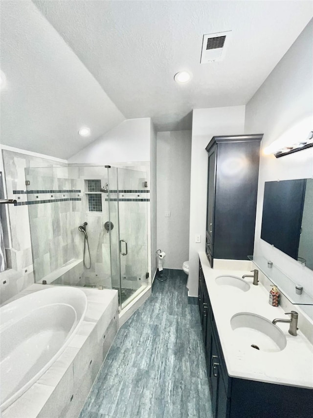 3209 Crimson Coast Dr, League City, TX 77573 - full bathroom featuring a garden tub, toilet, a shower stall, wood finished floors, and double vanity