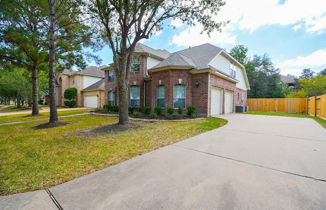 16535 Ruby Meadow Dr, Houston, TX 77095 - view of front of property featuring brick siding, central AC unit, driveway, and a garage