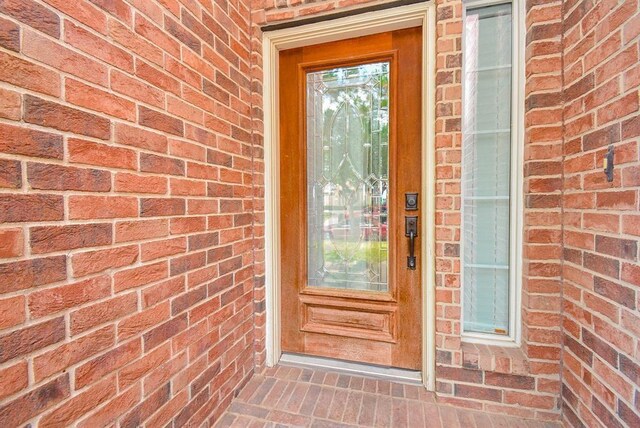 16535 Ruby Meadow Dr, Houston, TX 77095 - property entrance with brick siding