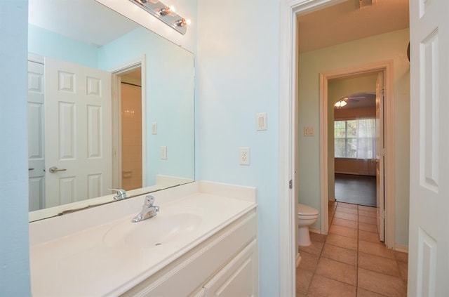 16535 Ruby Meadow Dr, Houston, TX 77095 - bathroom with tile patterned flooring, toilet, vanity, and baseboards