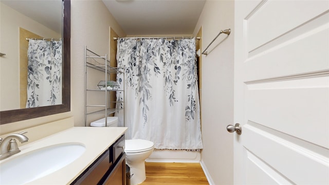 1911 Thunder Ridge Way, Houston, TX 77089 - full bathroom with toilet, vanity, wood finished floors, and shower / tub combo