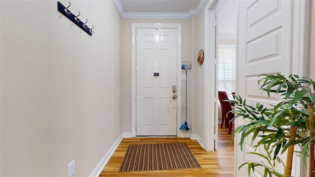 1911 Thunder Ridge Way, Houston, TX 77089 - doorway to outside with light wood-style flooring, crown molding, and baseboards