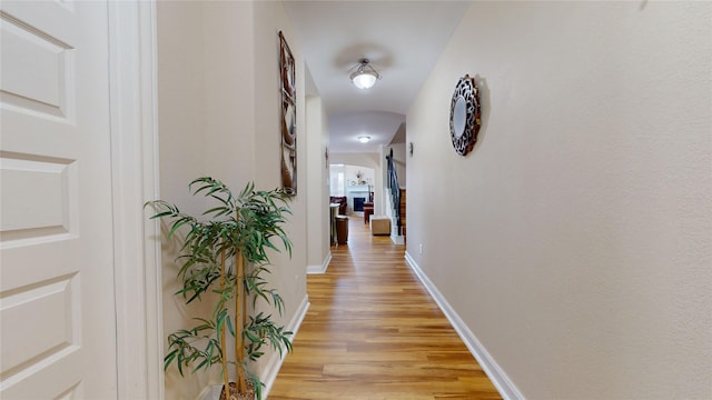 1911 Thunder Ridge Way, Houston, TX 77089 - corridor with light wood-type flooring and baseboards