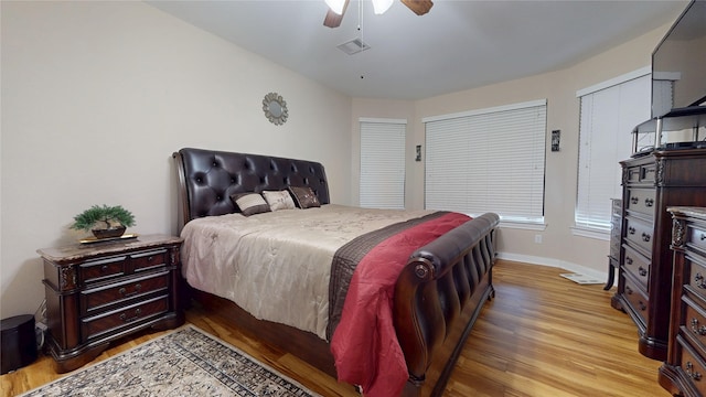 1911 Thunder Ridge Way, Houston, TX 77089 - bedroom featuring light wood-type flooring, baseboards, and a ceiling fan