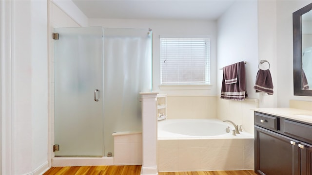 1911 Thunder Ridge Way, Houston, TX 77089 - full bath featuring a stall shower, a bath, wood finished floors, and vanity