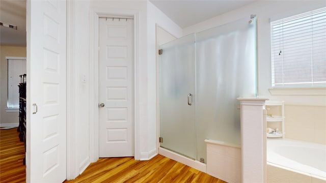 1911 Thunder Ridge Way, Houston, TX 77089 - full bathroom featuring a stall shower, wood finished floors, and a garden tub