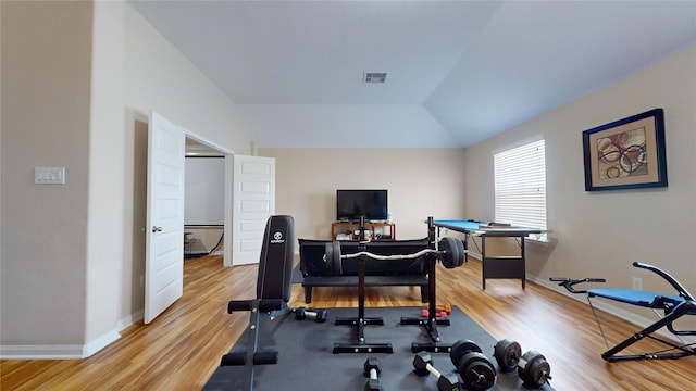 1911 Thunder Ridge Way, Houston, TX 77089 - workout room featuring wood finished floors, baseboards, and lofted ceiling
