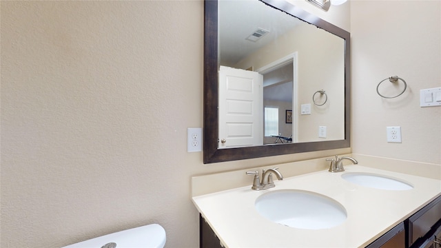1911 Thunder Ridge Way, Houston, TX 77089 - bathroom with double vanity and toilet