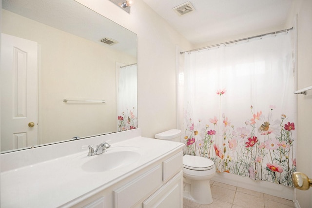 2385 Golden Shores Ln, League City, TX 77573 - bathroom with vanity, toilet, tile patterned floors, and shower / tub combo