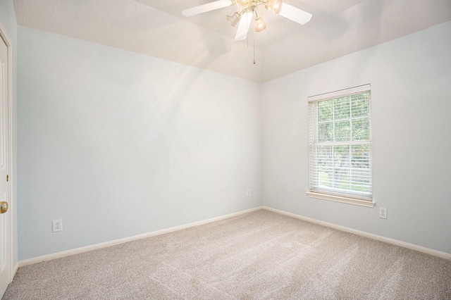 2385 Golden Shores Ln, League City, TX 77573 - empty room featuring light carpet, ceiling fan, and baseboards
