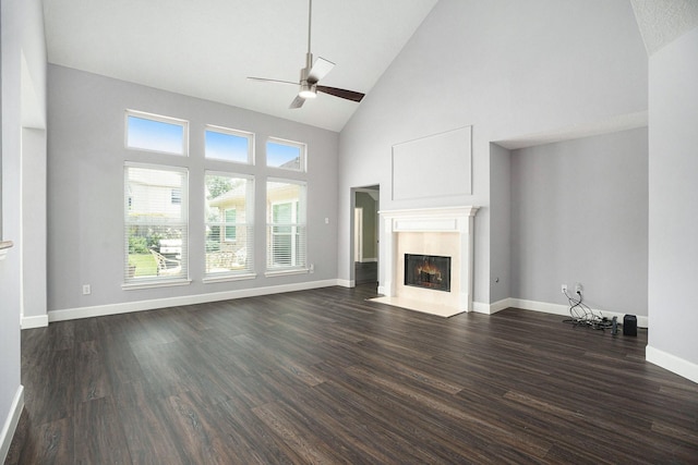 2385 Golden Shores Ln, League City, TX 77573 - unfurnished living room featuring high vaulted ceiling, a fireplace, a ceiling fan, dark wood-style floors, and healthy amount of natural light