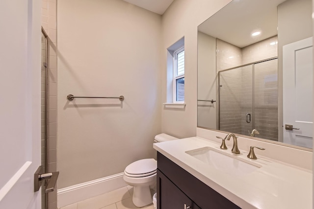 407 N Nagle St Unit E, Houston, TX 77003 - bathroom featuring toilet, a shower stall, tile patterned floors, vanity, and baseboards