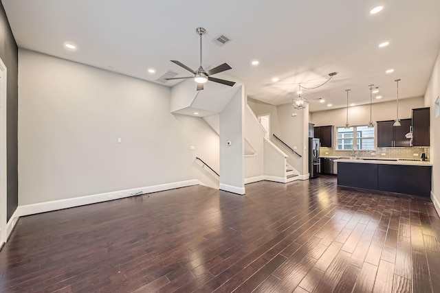 407 N Nagle St Unit E, Houston, TX 77003 - unfurnished living room featuring dark wood finished floors, recessed lighting, ceiling fan, baseboards, and stairway
