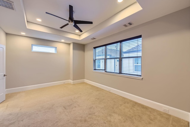 407 N Nagle St Unit E, Houston, TX 77003 - empty room with ceiling fan, recessed lighting, carpet floors, a raised ceiling, and baseboards