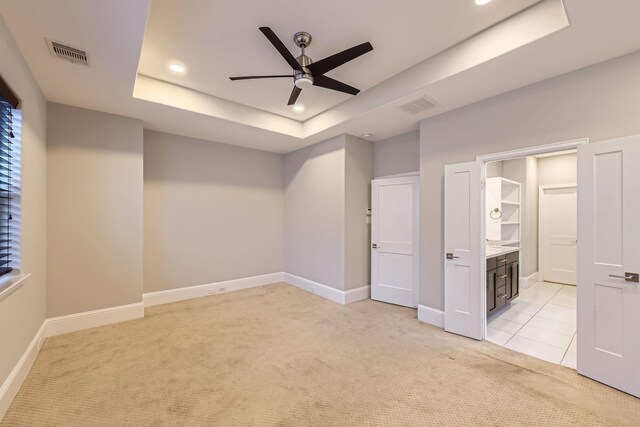 407 N Nagle St Unit E, Houston, TX 77003 - unfurnished bedroom featuring light carpet, a tray ceiling, recessed lighting, baseboards, and a ceiling fan